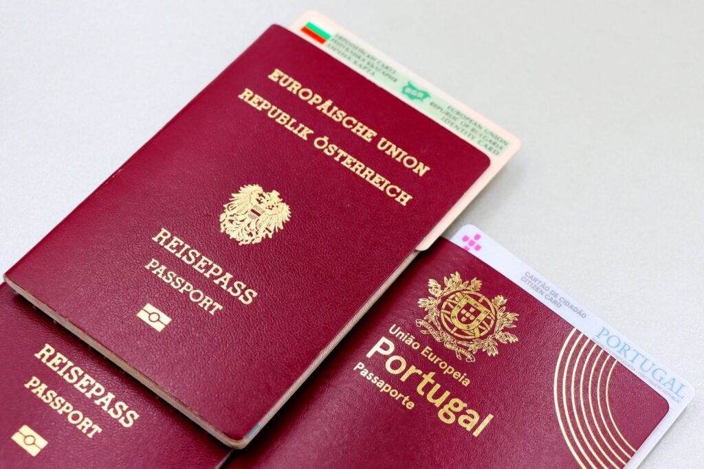 A passport and identity documents laid on a surface