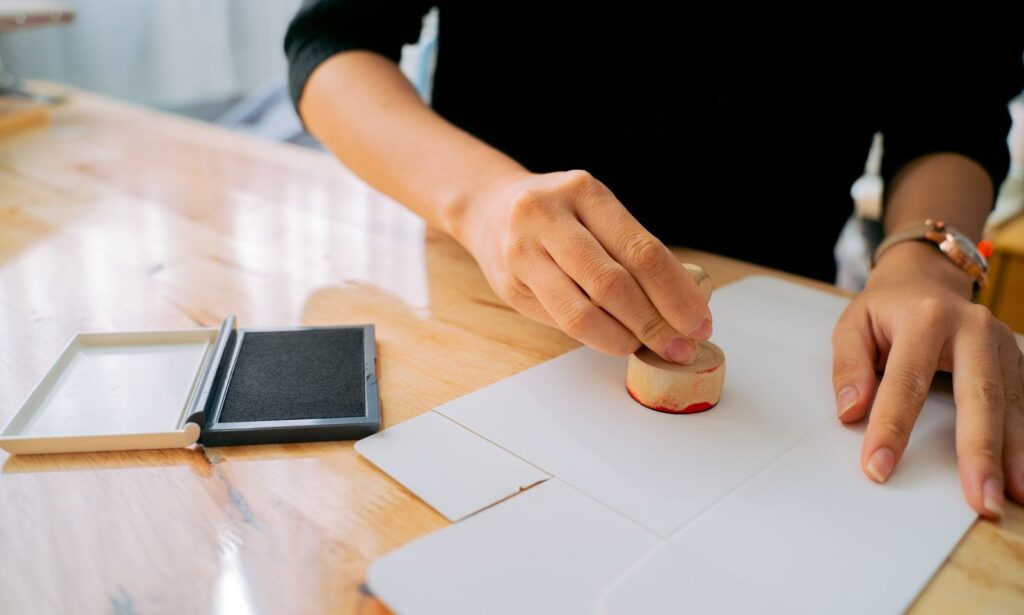 A notary stamp and seal resting on a document
